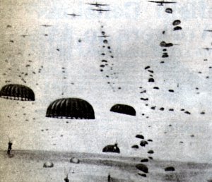 Paratroopers descending from the transport planes